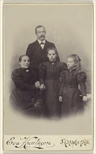 Family portrait: mother, father, and two daughters; Eva Knutsson, Swedish, active Halmstad, Sweden 1860s - 1870s, 1885 - 1890