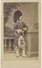 soldier in kilt and feathered bonnet; Porral, British, active Gibraltar 1860s, 1870s; Albumen silver print