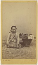 Javanese woman seated with legs crossed, basket at side; Woodbury & Page, British, active 1857 - 1908, about 1870; Albumen