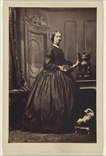 woman holding a book,standing; Camille Silvy, French, 1834 - 1910, 1862 - 1865; Albumen silver print