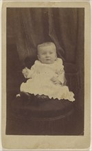 baby seated in dark-colored chair with tassels; Peter S. Weaver, American, active Hanover, Pennsylvania 1860s - 1910s