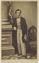 man holding a hat, standing; 1865 - 1870; Albumen silver print