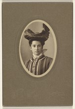 woman wearing a feathered hat, printed in oval cut; Bloomingdale Brothers; October 1904; Gelatin silver print