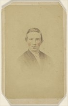 young man, printed in vignette-style; Isaac Rehn & Sons; 1865-1875; Hand-colored albumen silver print