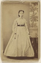 woman in checkered dress, standing; 1865 - 1875; Albumen silver print