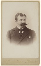 man with a variant type Vandyke beard and moustache , printed in vignette-style; S. Gerschel aine; about 1890; Gelatin silver