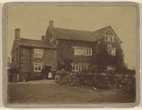 View of  large house with people at front door; 1870s; Albumen silver print
