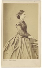 French woman in profile, standing; Bayard & Bertall; about 1862; Albumen silver print