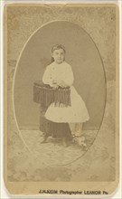 little girl posed on chair with tassels, printed in quasi-oval style; J.H. Keim, American, active 1920s, 1865 - 1870; Albumen