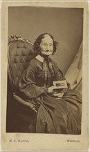 Elderly woman holding a photograph; Henry F. Warren, American, active 1860s - 1870s, Waltham, Massachusetts, United States