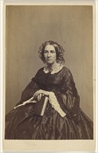 woman holding a book, seated; K.W. Beniczky, American, active New York, New York 1850s - 1860s, 1865 - 1870; Albumen silver