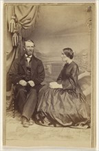 bearded man and a woman, seated; Bradley & Rulofson; 1863 - 1866; Albumen silver print