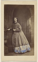 Girl standing at a dais; Ross & Thomson, Scottish, active about 1850s, Edimburgh, England; 1862-1864; Hand-colored Albumen