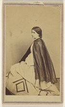 woman wearing a dark cape, seated, at 3,4 profile; Churchill & Denison; about 1867; Albumen silver print