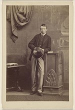 man holding a top hat and cane; Camille Silvy, French, 1834 - 1910, 1866; Albumen silver print