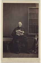 man seated, holding a newspaper; Camille Silvy, French, 1834 - 1910, about 1866; Albumen silver print