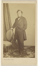 man wearing wire-rimmed glasses, standing; Bisson Frères, French, active 1840 - 1864, 1862 - 1871; Albumen silver print