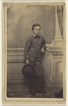 well-dressed young boy standing, holding a derby; S.B. Howard, American, active Pottsville and Reading, Pennsylvania 1860s