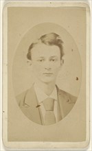 young man, printed in quasi-oval style; New York Photograph Room; 1865 - 1875; Albumen silver print