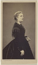 woman wearing a dark dress, standing, in profile; Pierre Petit, French, 1832 - 1909, 1865 - 1870; Albumen silver print
