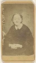 older woman with hands clasped, seated; E. Murphy & Brother; 1870 - 1875; Albumen silver print