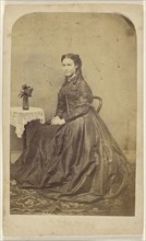 woman with long curls, seated; about 1867; Albumen silver print