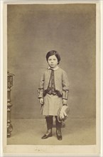 little girl standing, holding hat; A. Crowe, British, active 1860s - 1870s, about 1865; Albumen silver print
