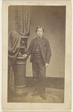 well-dressed young man, standing; A. Crowe, British, active 1860s - 1870s, about 1865; Albumen silver print