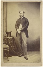 Man holding a cane under his arm; American; 1864 - 1865; Albumen silver print