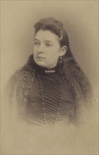 woman with long wavy hair, printed in vignette-style; Mayhew Brothers; 1870 - 1875; Albumen silver print