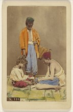 man with basket standing, plus two boys seated playing cards; Giorgio Conrad, Italian, active 1860s, 1865 - 1870; Hand-colored