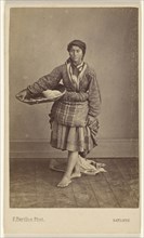 woman of Bayonne, France, wearing her native costume, standing, holding a basket; Ferdinand Berillon French, active 1860s