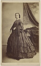 woman wearing a long dark dress, standing; Thomas Rodger, Scottish, 1832 - 1883, 1865 - 1870; Albumen silver print