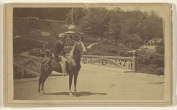 man wearing a hat on horseback near a bridge; A.S. Hinckley, American, active 1870s - 1880s, 1864 - 1866; Albumen silver print