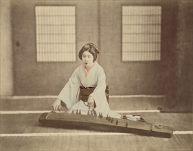 Japanese Woman Playing a Koto; Japan; 1890s; Hand-colored Albumen silver print
