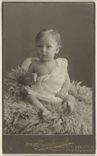 baby seated on a lamb-skin rug; Atelier Rembrandt, French, active Strasbourg, France 1880s - 1910s, 1880 - 1890; Platinum print