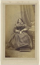 Woman seated, holding a book in her lap; Heath & Beau, British, active 1860s, 1862-1863; Albumen silver print