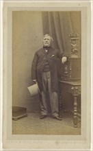 Man standing, holding a top hat; Heath & Beau, British, active 1860s, 1862-1863; Albumen silver print