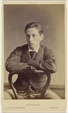 young man seated, with arms on chair back; Hills & Saunders, British, active about 1860 - 1920s, 1862 - 1865; Albumen silver