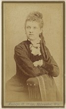 woman seated with arms crossed on chair arm; Rudolph H. Wilde, American, active Milwaukee, Wisconsin 1860s, 1865 - 1875