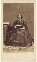 woman seated, reading a book; Disdéri & Cie; 1862 - 1865; Albumen silver print