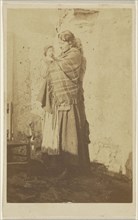 woman wearing a shawl, holding a baby; 1865 - 1870; Albumen silver print