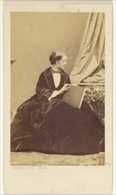 woman seated with a folio in her lap; Disdéri & Cie; 1862 - 1866; Albumen silver print