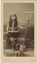 little girl seated on rock, holding a fishing net basket; Jules Brechet, French, active Caen, France 1860s, 1870 - 1875