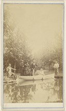 Group of people near a lake, one woman in a canoe; 1870 - 1880; Albumen silver print
