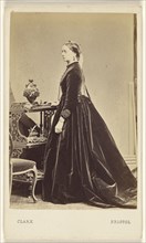 woman wearing a long dress, in profile, standing; William Clark, British, active 1860s, 1865 - 1875; Albumen silver print