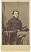 man with muttonchops seated, holding a top hat; Charles DeForest Fredricks, American, 1823 - 1894, 1864 - 1865; Albumen silver