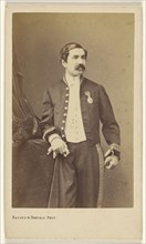 man with moustache standing, wearing a medal on his lapel; Bayard & Bertall; about 1861; Albumen silver print