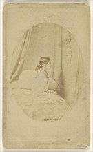 little girl in profile seated on a bed; Alophe Marie Alexander Menut, French, 1812 - 1883, 1870 - 1878; Albumen silver print