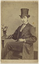 young man wearing a top hat, seated; T. Lake, British, active 1860s, 1864 - 1865; Albumen silver print